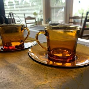 Duralex orange glass espresso cups with saucers